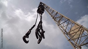 Four hooks. Old faucet. Cargo handling devices. Loading and unloading cargo. Sling type "spider" for lifting loads. Construction equipment. Jib. Rise and lowering.