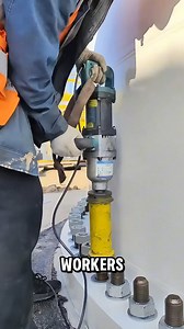 Workers press a handheld tool against the base and let it spin hard | Rest Studio