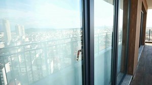 Download Modern front window with thin curtains and house walls from the outside view. for free