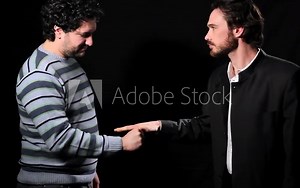 Two men playing paper rock scissors Stock Video