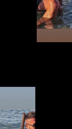 Muscular Man Showcasing Tattoos by the Water