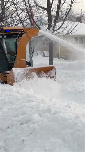 When sidewalks disappear under deep snow, the Trackless Twin Auger Snowblower gets to work!