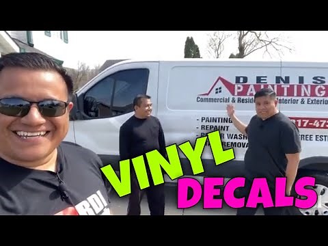 Applying decals on work van