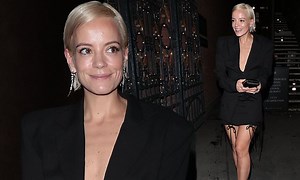 Lily Allen puts on a leggy display in plunging black mini dress