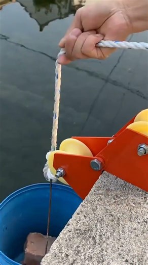 Using a pulley tool to lift water from the river efficiently. Simple method, useful and satisfying