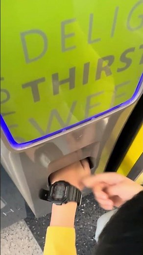 Buying snacks from vending machine at airport!