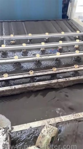 Live footage of the filter press performing continuous filtration.