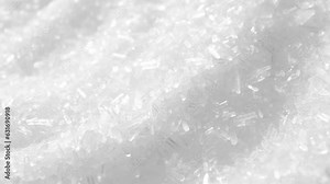 Monosodium glutamate (MSG) is a flavor enhancer commonly used in food. In a macro video, explore its fine, crystal-like structure and watch as it dissolves into a savory delight. Food background.