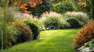 Fresh green grass shrubs flowers and a wellmaintained garden landscape design. Concept Gardening, Landscaping, Greenery, Floral Arrangements, Outdoor Spaces