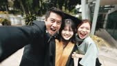 proud Asian Chinese parents selfie their daughter in college...