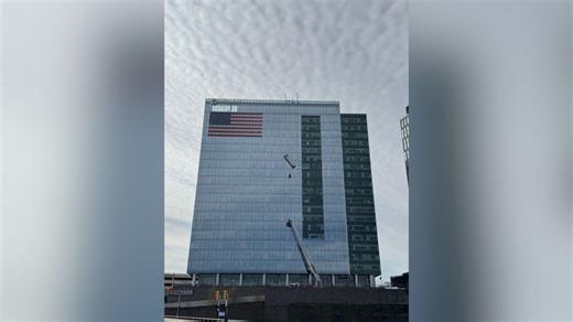 2 window washers seen hanging on side of Tysons high-rise building during rescue