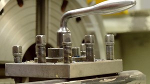 Lathe - mounting a tool post with a metal cutting tool | Premium Stock Video Footage