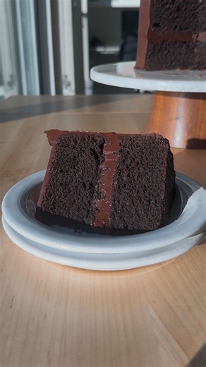 Sloane Papa on Instagram: "this little chocolate fudge cake is always a huge hit! it consists of two layers of decadent chocolate cake wrapped in a rich chocolate ganache. a great special occasion cake but also so fun to make just because🤎 comment “cake” to get the recipe sent to your DMs https://atsloanestable.com/chocolate-fudge-cake/ #chocolatecakerecipe #chocolatefudgecake"