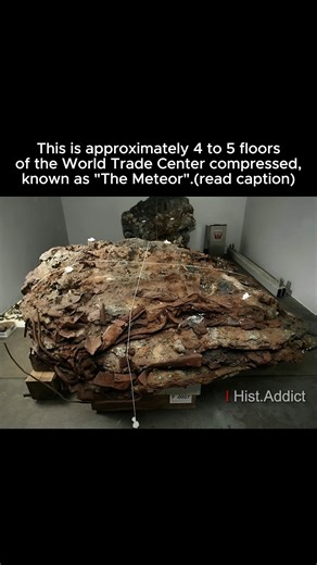 History Addict on Instagram: "Known as “The Meteor,” this massive steel fragment is one of the most striking remnants recovered from the World Trade Center site after the September 11, 2001 attacks. Weighing several tons, it is believed to consist of approximately four to five floors of the tower compressed together by the immense force of the collapse, forming a dense, contorted shape that resembles a fallen celestial object. Its warped beams and fused metal illustrate the extraordinary structu