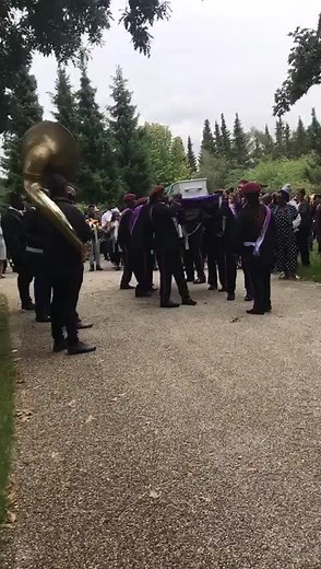 Solemn Funeral Procession with Casket and Attire