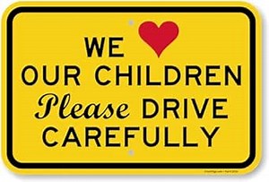 SmartSign 12 x 18 inch “We Love Our Children Please Drive Carefully” Metal Sign, 63 mil Laminated Rustproof Aluminum, Red, Black and Yellow