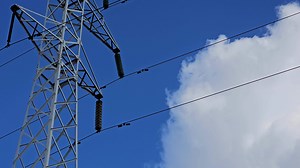 High voltage towers on skies background. Transmission line tower.