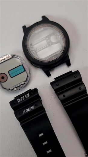 Are G-Shocks indestructible or self-destructing? This watch was in a service bag in the repair bin, untouched for the past 10 years. Decided to install a battery and get it back in action, until the outer plastic case (technically called the resin bezel) cracked in half and crumbled to pieces. But it doesn't have to become a parts watch! It is still salvageable with just the center case assembly and an 18mm nylon strap. It actually looks kinda cool. (PS - The pushers won't stick out that far whe