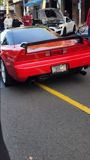 early acura nsx is red with some period correct modifications leaving cars and coffee