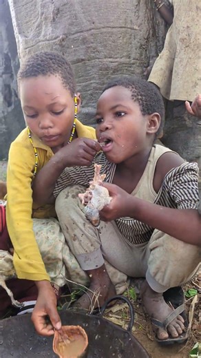 Traditional Hadzabe tribe cooking wild meat in Tanzania.Village food and African culture lifestyle.