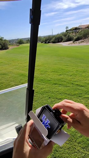 Looking for the perfect golf accessory for game days and tee times? The NCAA Phone Caddy keeps your phone secure while you rep your team on the course. 👇 📱 Fits almost all phones 🛝 Slides in and out with ease 🎨 Over 30 schools available 💨 Optional cigar holder 🌟 Over 500k golfers already love it | Desert Fox Golf