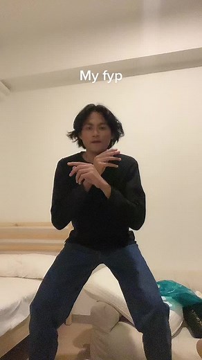 Engaging Dance Moves in a Cozy Bedroom Setting