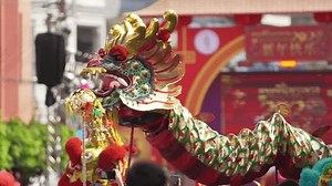 clip-1108836013-dragon-puppet-lion-perform-during-chinese-new