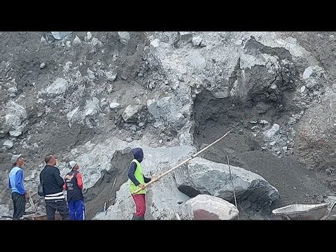 Dropping Chunks of Sand on The Cliff on The Right