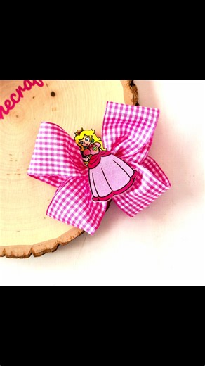 🎀✨ STOP SCROLLING 👀—you have to see this Princess Peach hairbow glow-up! My first one used a stiff ribbon (cute, but not quite right), so I found the perfect softer gingham ribbon 👑🍑. Here’s your BTS look at the bow assembly that makes every girly accessory lover’s heart skip! . . . . Keywords: Princess Peach hairbow, handmade gingham bow, girls princess accessories, custom ribbon hairbows, gingham hair accessory Hashtags: #CraftTok #GirlsFashion #princesspeachhairbow #handmadebows #ginghamb