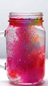 Sparkling Color Fireworks in a Jar Materials: - 1 clear glass jar or container (e.g., mason jar) - Vegetable oil - Water - Food coloring (various colors) - A small bowl - A spoon or dropper - Optional: glitter for extra sparkle Create a dazzling display of color and sparkle with this fun and easy project. Watch as the vibrant food coloring bursts and swirls in the oil, resembling colorful fireworks in a jar! | Through the Ages