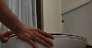 Download Nauseous Man Leans Over Toilet Trying Not Vomit for free