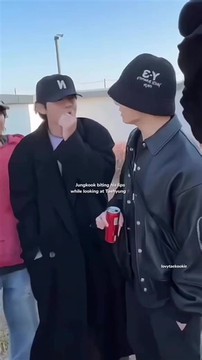 Jungkook's Charming Lip Bite Moment with Taehyung
