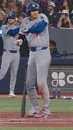 Shohei Ohtani let out a "F***" after getting hit in the funny bone by this pick off attempt