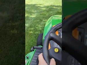 Mowing front lawn with John Deere s130