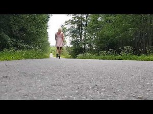 Hanna Crossdresser outside / outdoors in pink dress, high heels walking.