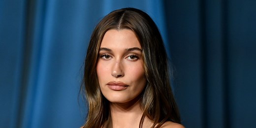 Hailey Bieber Poses Completely Naked Wearing Nothing but Her Bedsheets