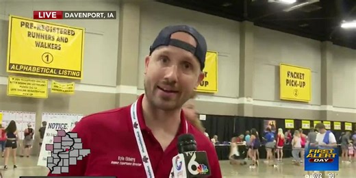 Bix runners pick up packets at The River Center