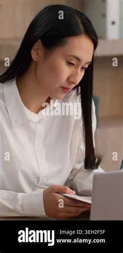 Attentive serious Asian Japanese Chinese business woman ethnic female girl Korean businesswoman office worker manager student writing notes diary plan online laptop video call computer meeting indoor Stock Video Footage - Alamy