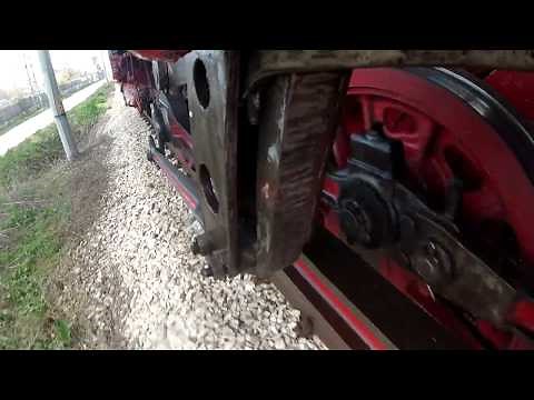 The driving gear of a running steam locomotive