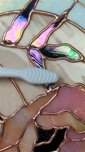 Did you know that the very last step of the stained glass process is buffing off wax, and scrubbing it out of every crevice? What does the wax do - it makes the glass and metal shine while removing tarnish and oxidation from the solder lines. It also leaves behind a protective film that slows down the oxidation process of the metal (which is inevitable). I actually enjoy this step, most people don't. #stainedglass #glassart #art #artprocess #process #wax #buffing #poppy #flowers #floraldecor #ho