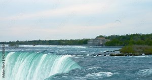 Close-up of rushing waters at Niagara Falls captures intense flow and dramatic drop. Niagara Falls offers awe-inspiring natural spectacle, perfect for nature, travel, adventure. View Niagara Falls.