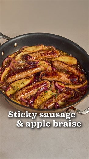 A fun twist on a British classic, watch as @angelacooking makes this colourful, sticky sausage and apple braise! 🍴🍎 📝 See the recipe. Save for later! 1 tbsp olive oil 6 No.1 British Free Range Wild Garlic Pork Sausages 2 red onions, cut through the root into thin wedges 1 Waitrose Jazz Apple, cut into thin wedges 250ml fresh chicken stock 1 tbsp wholegrain mustard 1 tsp clear honey 3 sprigs thyme Mashed potato, polenta or cooked Puy lentils, to serve (optional) 1. Preheat the oven to 200ºC, g