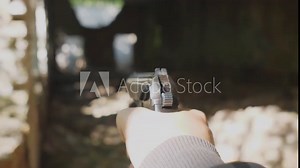 first person view Russian Makarov pistol shooting pneumatic training of Russian soldiers concept in the forest in summer or in an abandoned building
