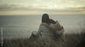 comforting friendly hug friends hugging empathy compassion sunset slow motion