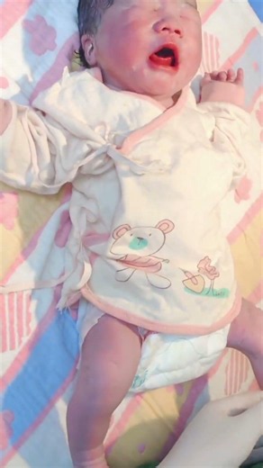This newborn is making its own crying for the first time