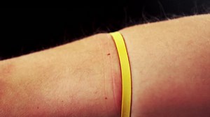 Hand pulling an elastic band | Premium Stock Video Footage