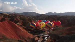 3.4K views · 506 reactions | What a view! 100 hot air balloons took off from Zhangye National Geopark, NW China's Gansu. | People's Daily, China | Facebook