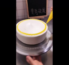 Decorating Yellow With Purple Icing Cake