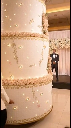 Best wedding entrance on giant pop out cake #fblifestyle | Lynda Okoli