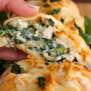 2.7K views · 53 reactions | Monterey Chicken Braid recipe – we are obsessed with this quick chicken braid. Pizza dough stuffed with chicken, Monterey jack cheese, spinach, garlic, and french fried onions. SO easy to make! FULL RECIPE: https://www.plainchicken.com/monterey-chicken-braid/ | Plain Chicken | Facebook